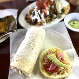 Ki’ikibáa signature dishes Carne Asada BurritoConchita Pibil Panucho De Pollo